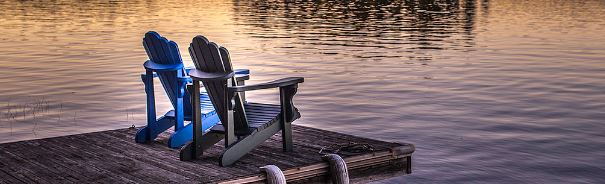 muskoka chairs at the lake